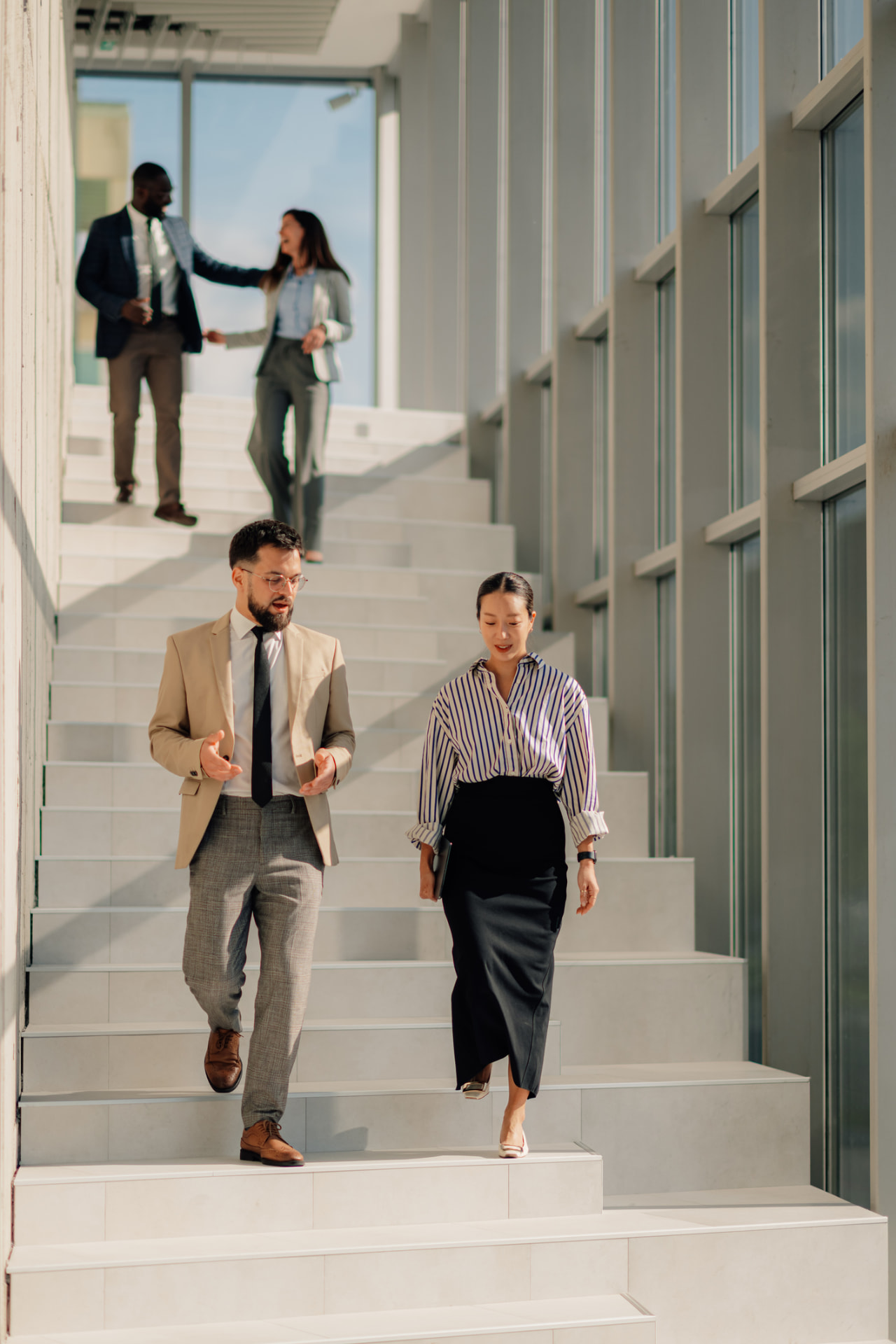 A recruitment consultant welcoming a client in a Singapore office